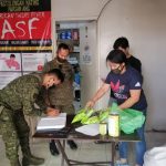 IN PHOTOS: Technical Sergeant Randy Rapada and Jonathan Suñez of the 2nd Infantry Division of the Armed Forces of the Philippines receive the seeds